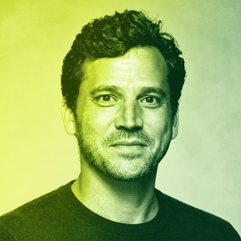 Duotone portrait of Liyam Flexer, with short curly hair and stubble